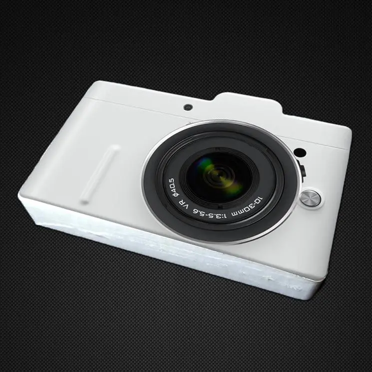 Tricouri comprimate in forma de aparat foto